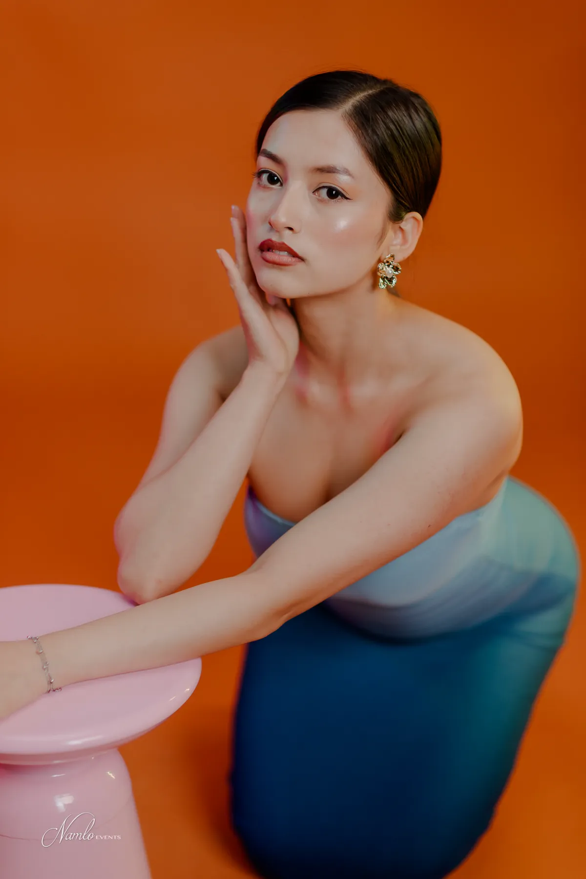 Studio portrait on orange